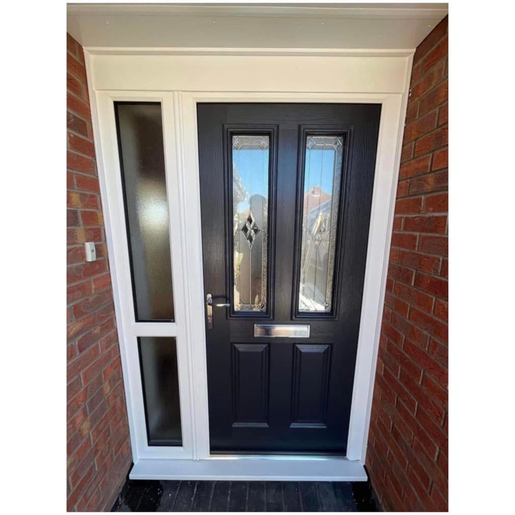 Black front door with two patterned glass panels and an obscure glazed side panel